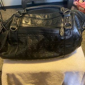 E. Caprice skull purse